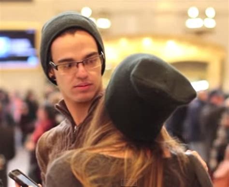 girl attempts to kiss strangers in grand central station on camera
