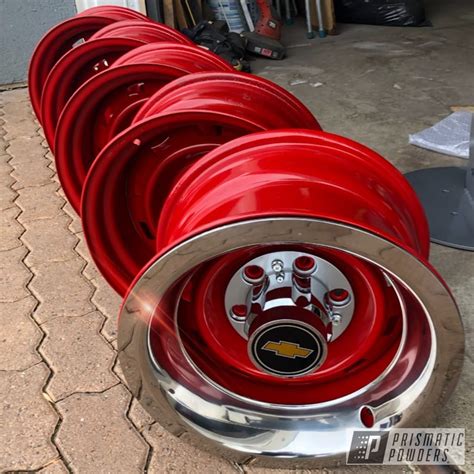 factory chevy rally wheels    red prismatic powders