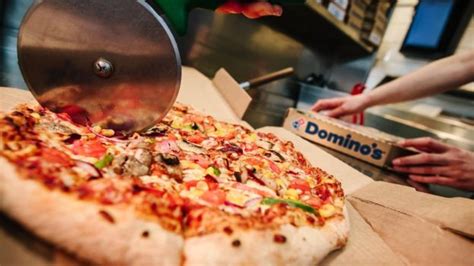 dominos pizza shares fall   franchise row bbc news