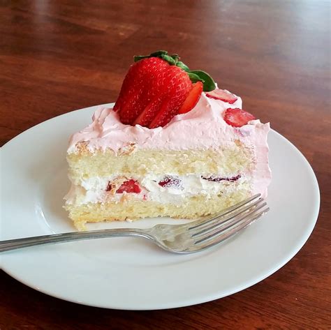 “very fancy” strawberries and whipped cream sponge cake rumbly in my tumbly