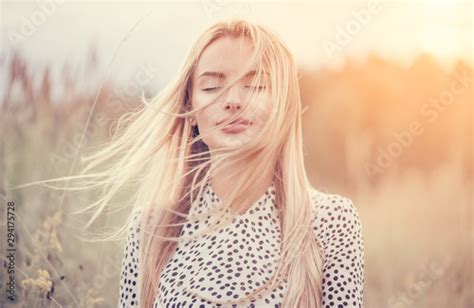 close up portrait of beauty girl with fluttering white hair enjoying