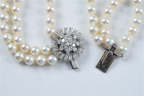 Three Strand Cultured Pearl Necklace With An 18k White Gold And Diamond