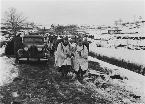 members of the prinz eugen division march down a road near the town