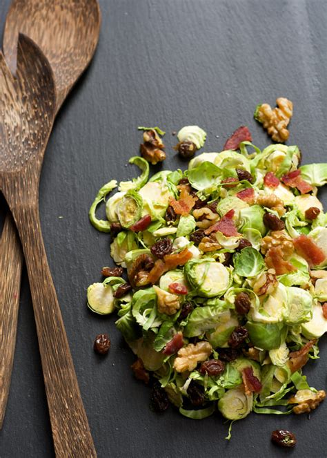 shaved brussels sprout salad with raisins and maple dijon