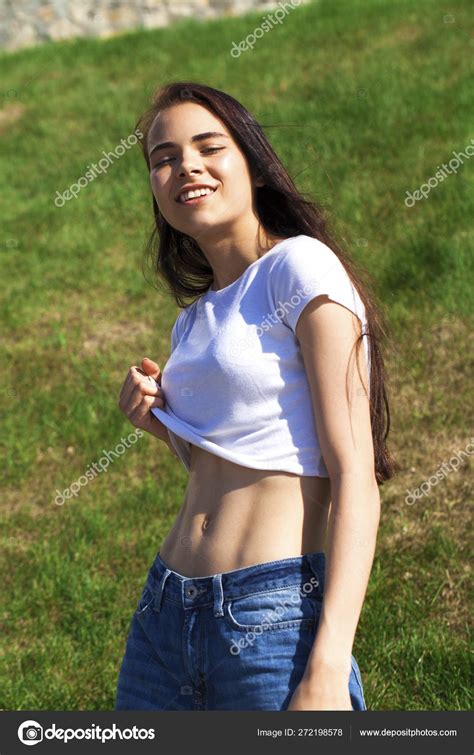 Young Beautiful Teenager Girl Posing Against Summer Park Bright Stock