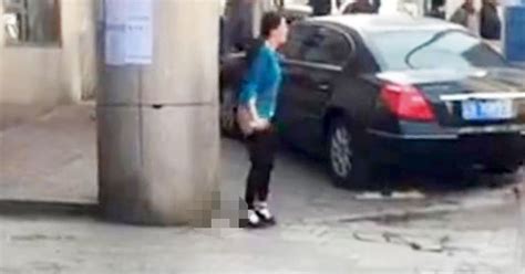 sickening video shows woman pooing in street outside train station as