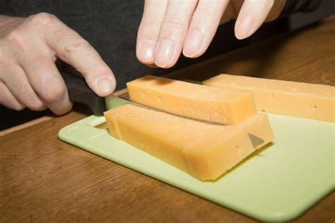 man cutting  slice  cheese stock photo image  france yummy
