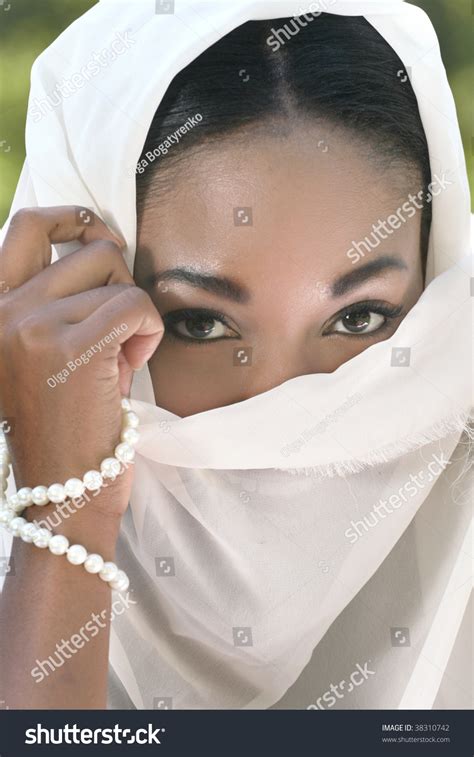 muslim islamic woman covering face  shawl  veil stock photo