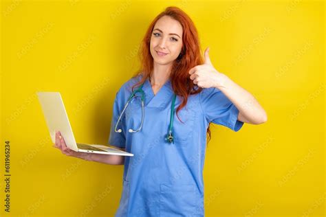 Beautiful Attractive Redhead Doctors Woman Wearing Blue Uniform Over