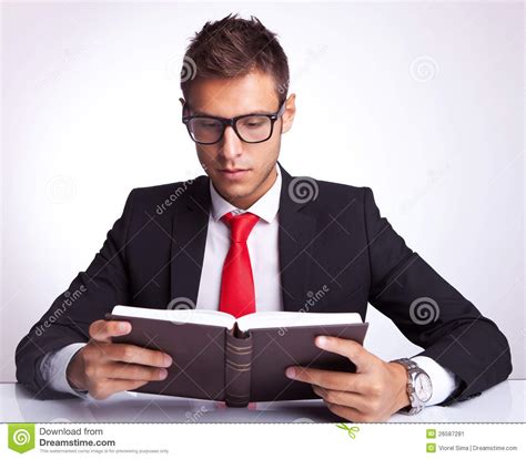 business man wearing glasses reading a book stock image image of
