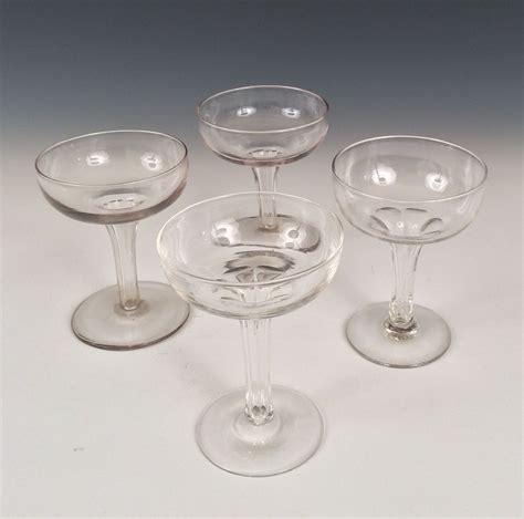 antique set of four hollow stem champagne glasses