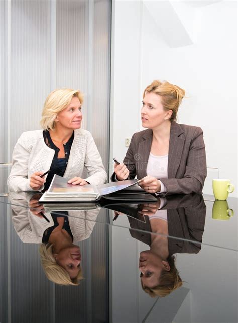 senior business women meeting stock image image  encouraging portfolio