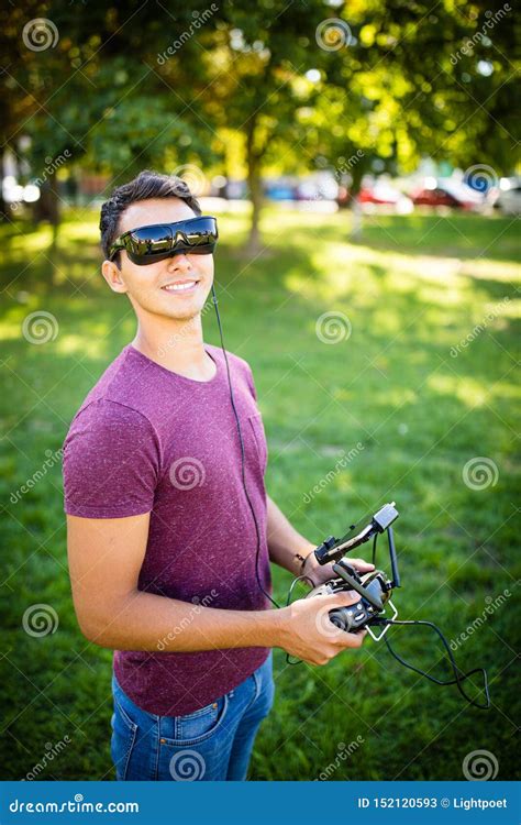 handsome young man flying  drone outdoors stock image image  leather hood