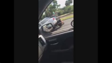 video car runs over motorcyclists in road rage incident