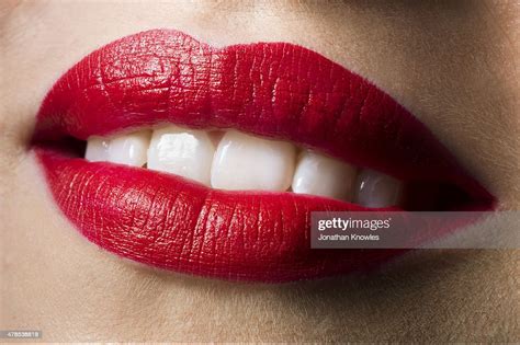 Female Smiling With Red Lipstick On Perfect Teeth Photo Getty Images