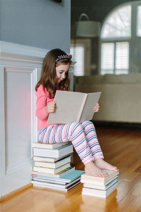 young girl reading telegraph