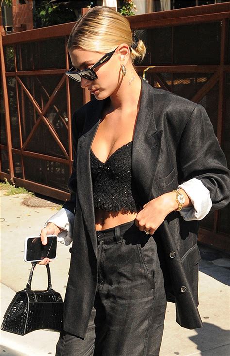 hailey baldwin s corset top shows abs in suit and reveals