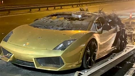 businessman watches   gold wrapped lamborghini    flames   hour