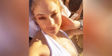 jennifer lopez shows toned butt and arms in swimsuit instagram video