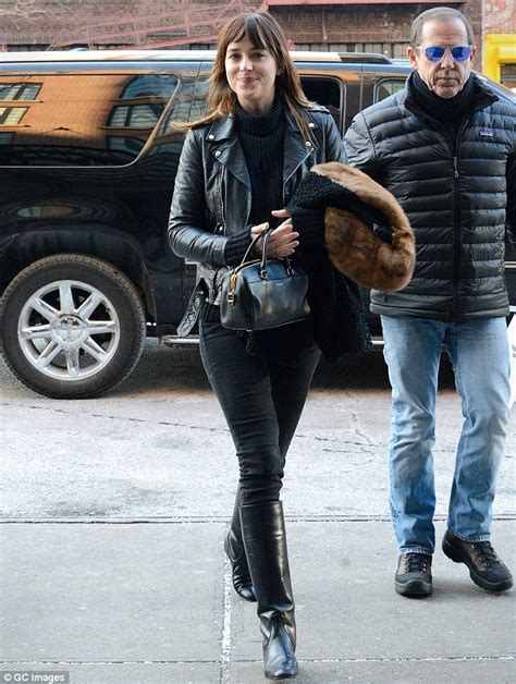 dakota johnson wears black from head to toe while out and