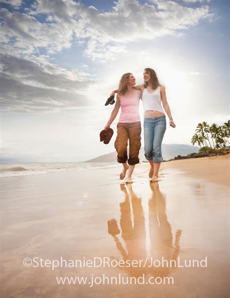 Mother Daughter Conversation While Walking On A Tropical Beach
