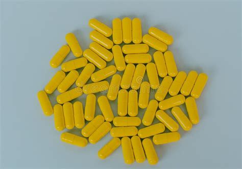 yellow tablet medicine pill capsule stock image image  closeup