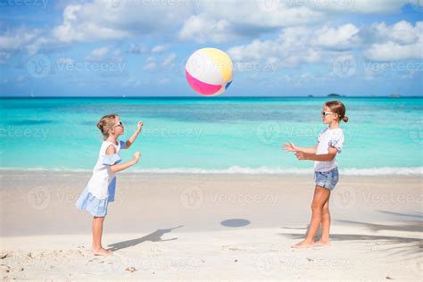 adorable girls playing  ball   beach kids  fun
