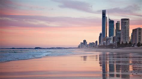 photo tall city buildings  beach shore  sunset
