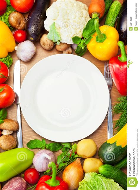 organic vegetables  white plate  knife  fork