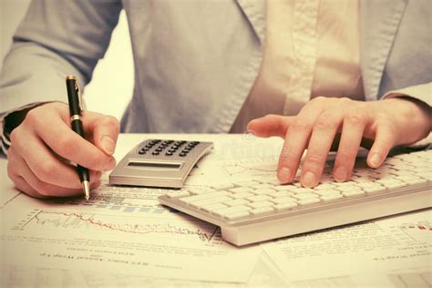 financial accounting business woman  calculator  computer keyboard stock photo image