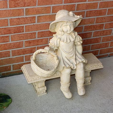 resin garden sculpture  girl holding basket late  century ebth