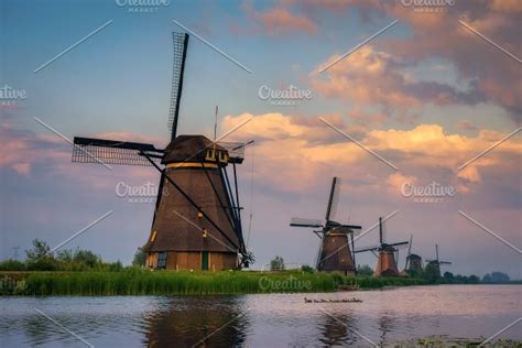 Old Dutch Windmill At Sunset In Kinderdijk Netherlands