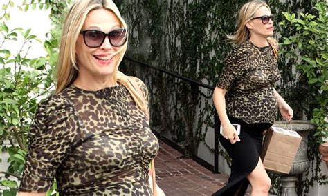 molly sims cuts a maternal figure in leopard print top in