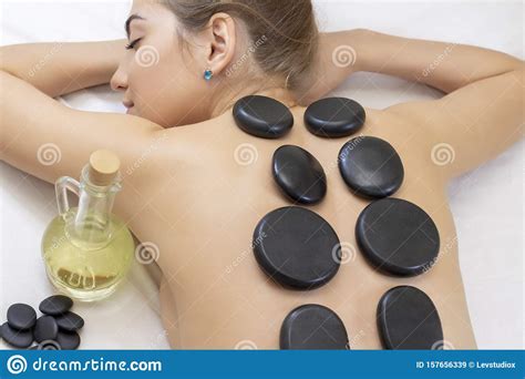 spa hot stone massage stone treatment woman getting a