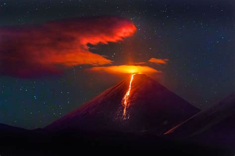 volcano erupting  night