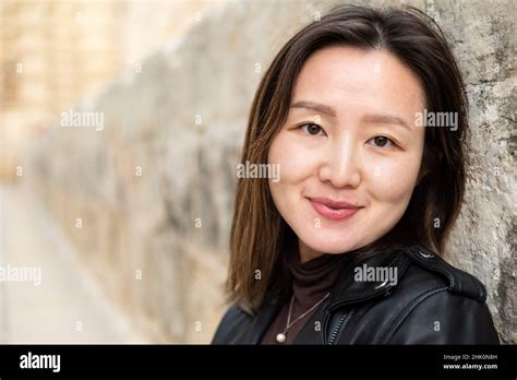 head shot portrait of an attractive 29 year old asian american girl