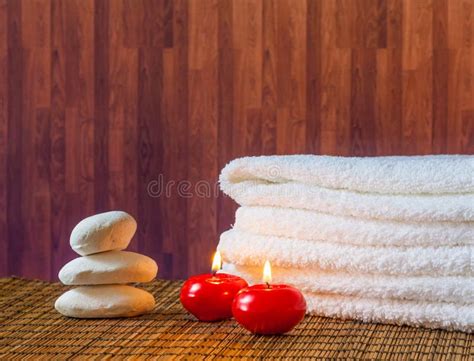 Spa Massage Border Background With Towel Stacked Stone And Red Candles