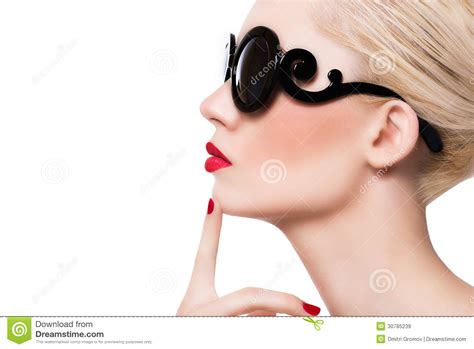 beautiful blonde girl in sunglasses with red lips on white background