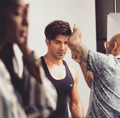 check out varun dhawan shows off his buffy arms during an ad shoot latest bollywood news