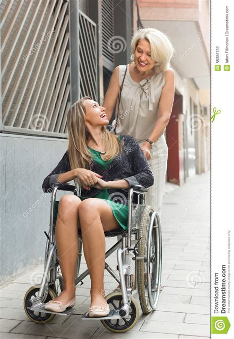 social worker and disabled woman at stroll stock image image of