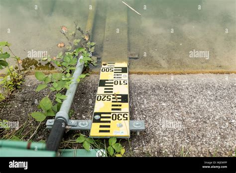flood measuring rod   water  measure  water level stock photo alamy