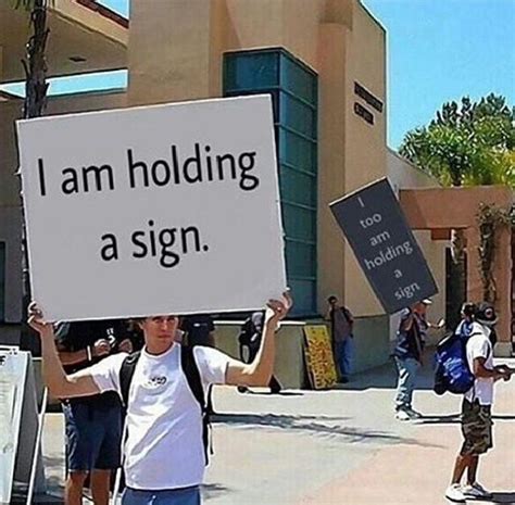 people holding signs rnotinteresting