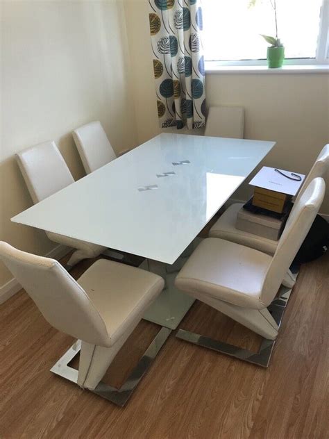 glass dining table   leather chairs  ballynahinch county
