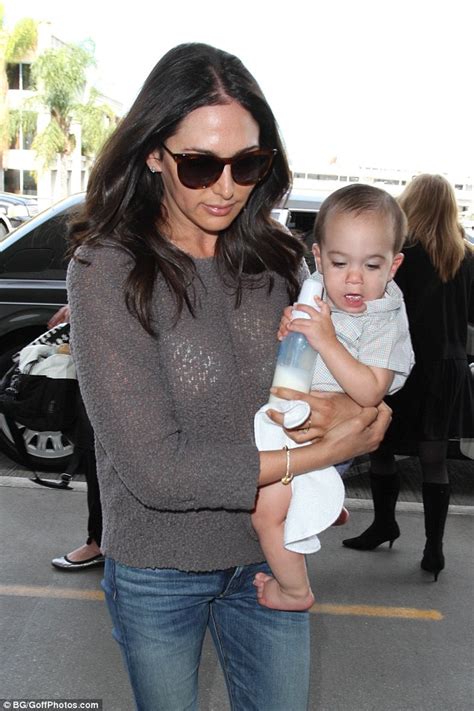 lauren silverman cradles son eric at lax one day after tot jetted in