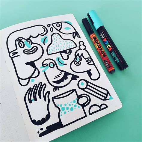 drawing book  markers  pens      blue surface    image   man