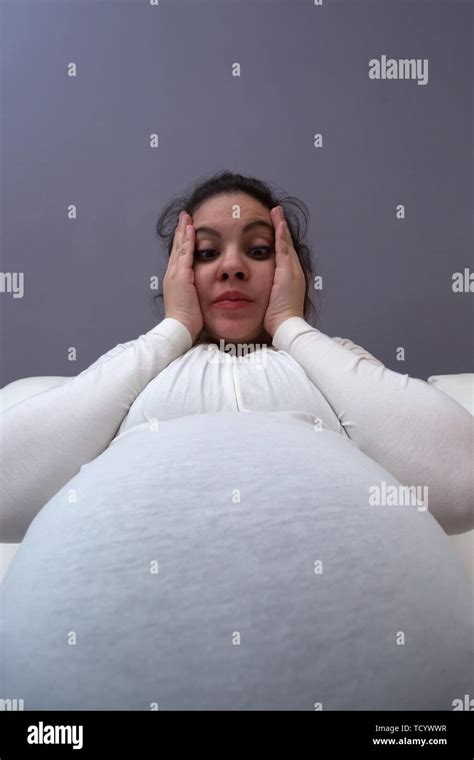 Humorous Shocked Reaction Of Pregnant Mom To Her Big Growing Tummy