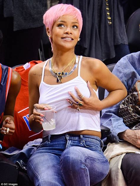 rihanna shows off pink hair at la clippers playoff game