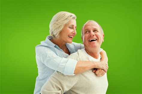 Composite Image Of Happy Mature Couple Smiling At Each Other Stock