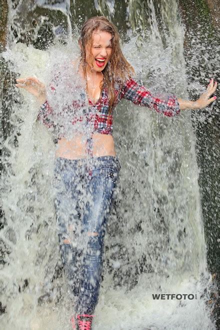 wetlook by two soaking wet girls in shirts tight jeans and sneakers wetlook one