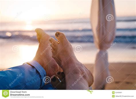 couple at the beach at sunset stock image image of
